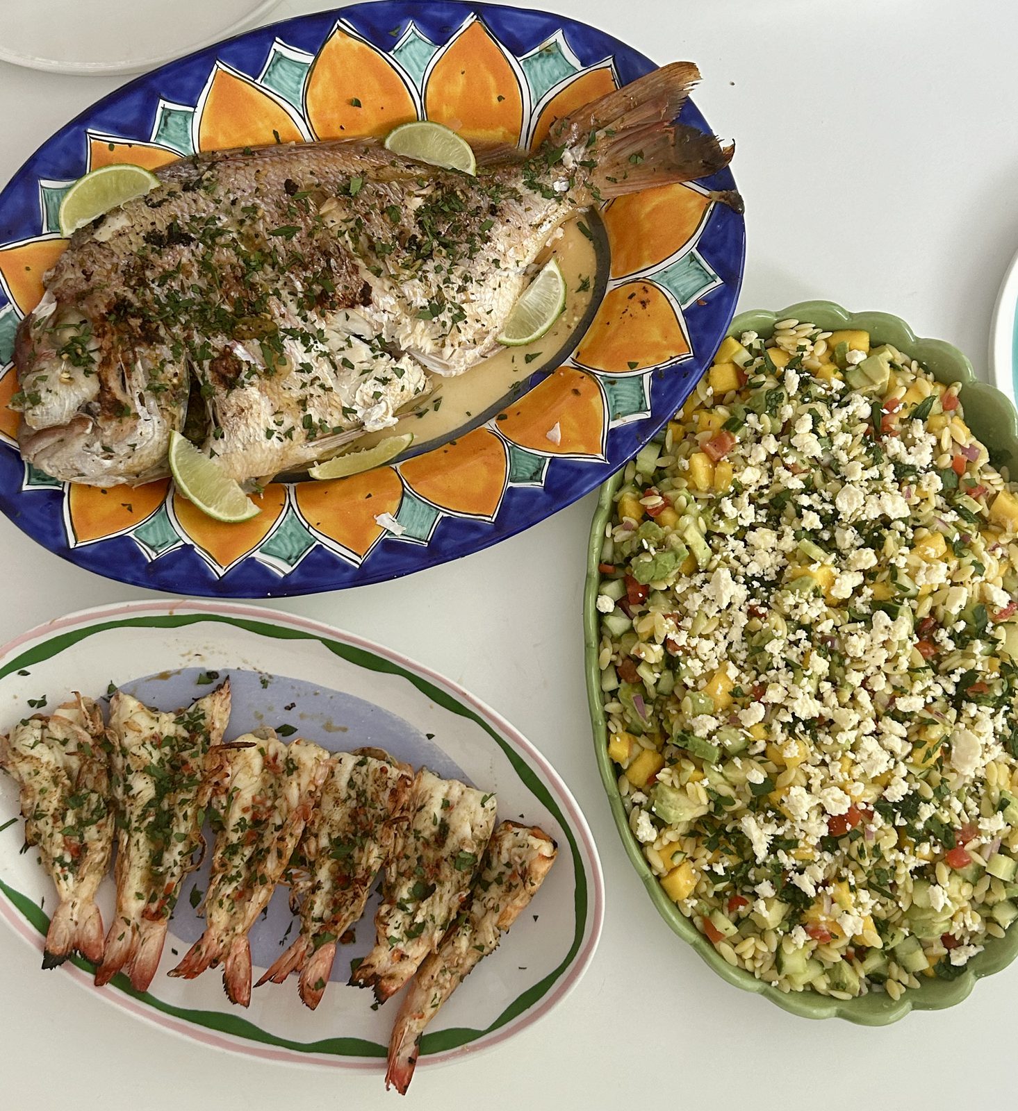 BBQ whole fish, king prawns and mango orzo salad platter