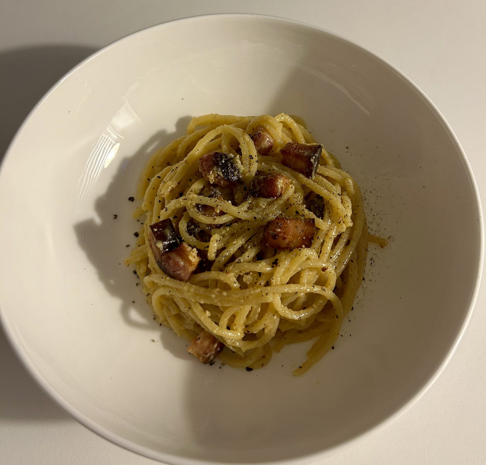 Spaghetti carbonara with guanciale and black pepper