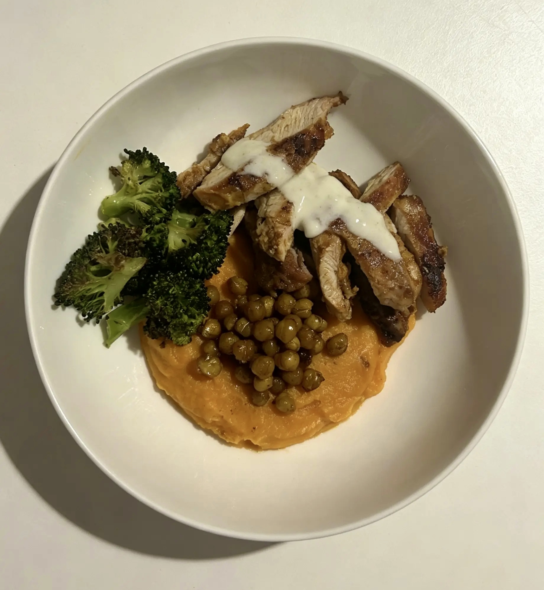 Chicken shawarma bowl with sweet potato puree and crispy chickpeas