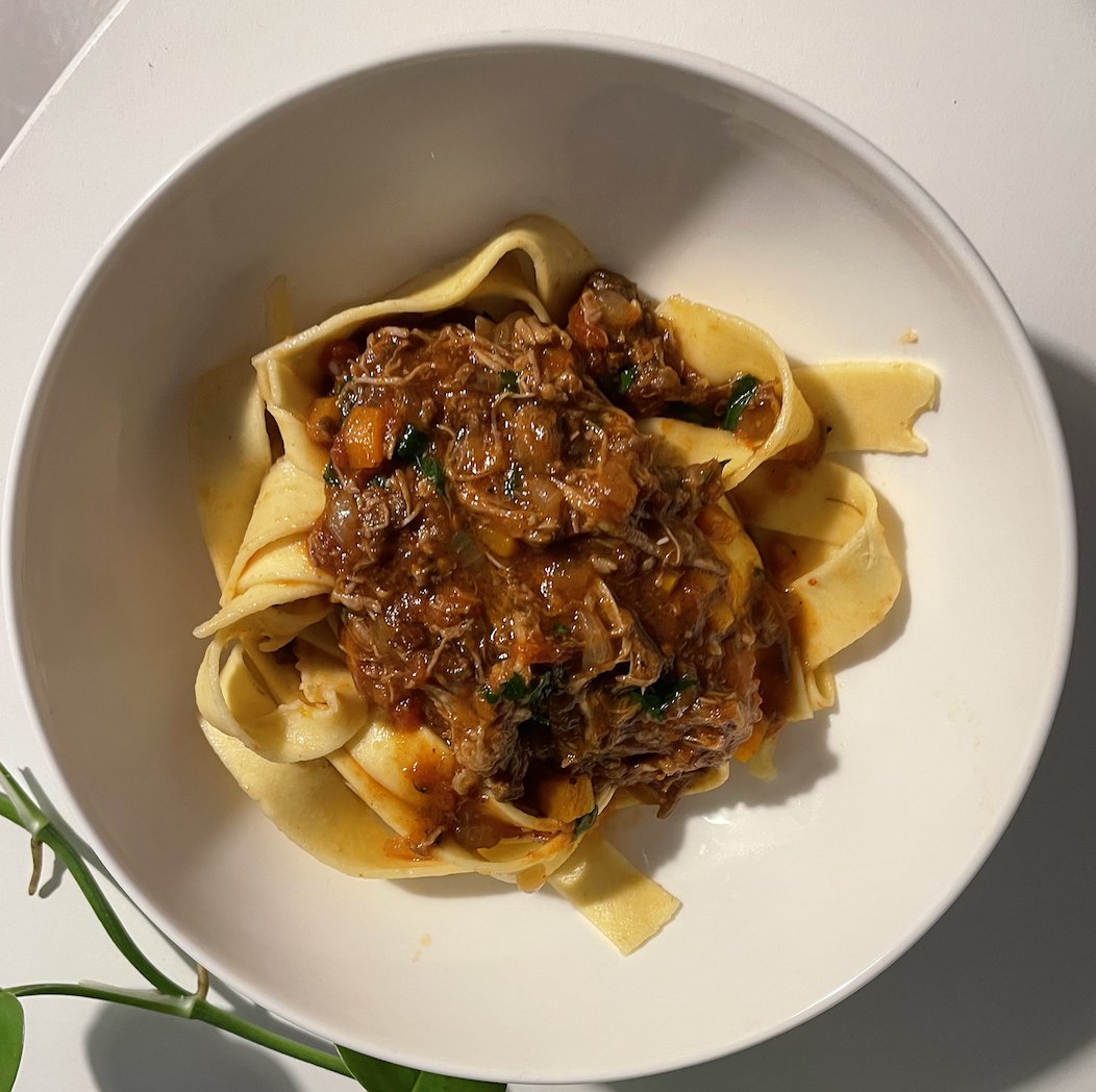 Beef ragù with shredded beef over pappardelle